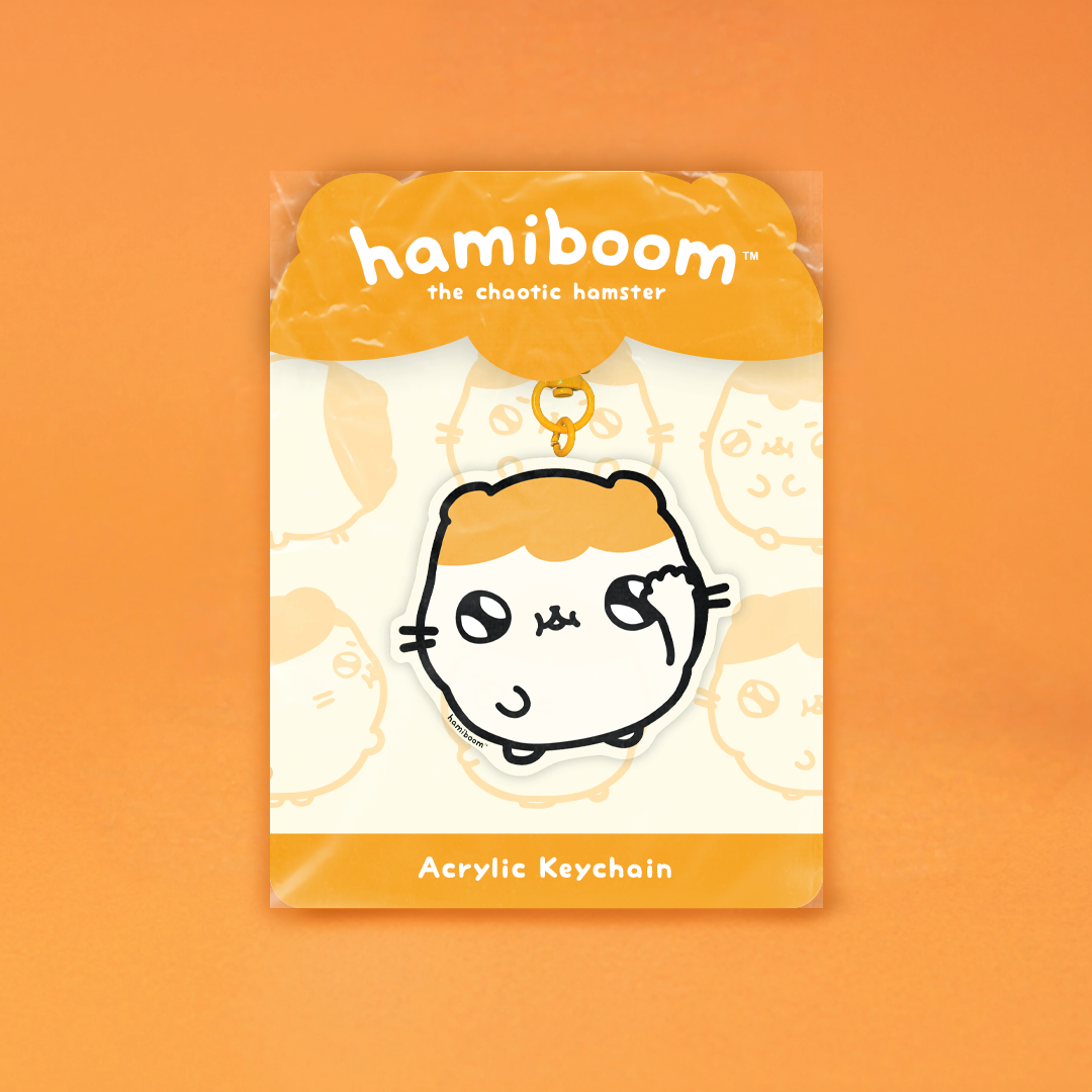 Acrylic keychain packaging with 'hamiboom' branding on an orange background