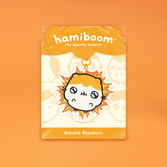 Acrylic keychain packaging with 'hamiboom' branding on an orange background
